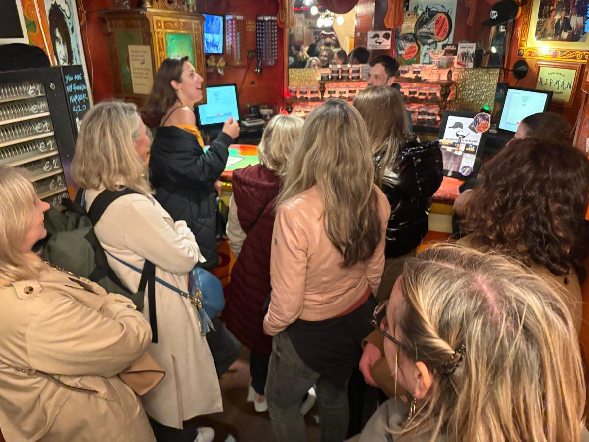 Tour group inside an Amsterdam coffeeshop during a cannabis culture tour