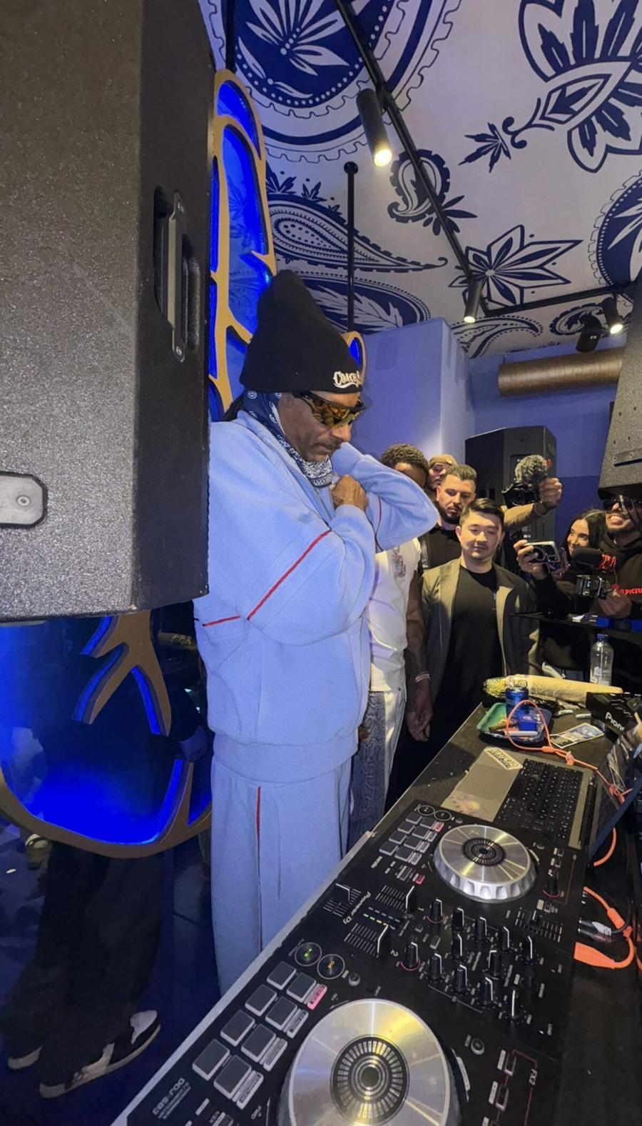Snoop Dogg at the DJ booth during an Amsterdam night out with Oranje Umbrella